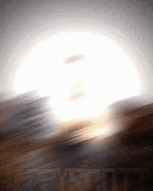 a blurred image of a sunset with the word everything in the corner