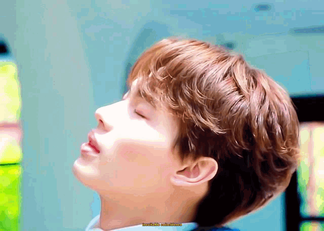 a close up of a person 's face with their eyes closed
