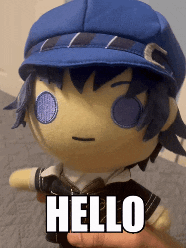a person is holding a stuffed toy with the word hello on it