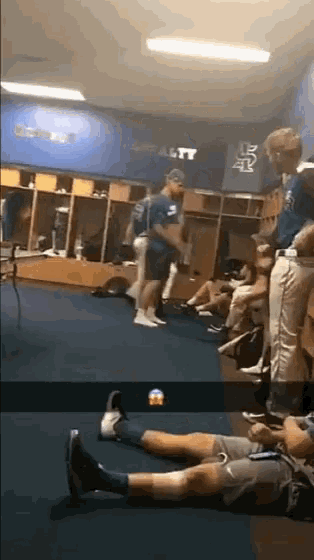 a group of people in a locker room with loyalty written on the wall
