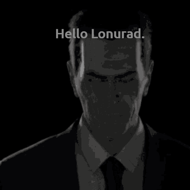 a man in a suit and tie is saying hello lonurad .
