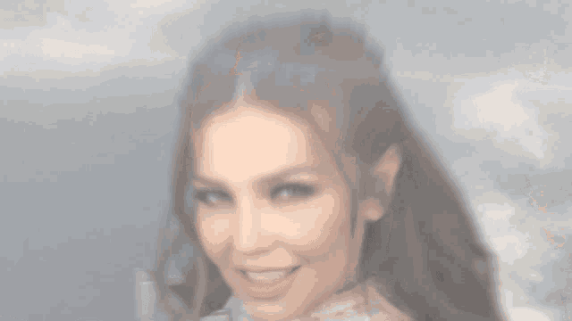 a close up of a woman 's face with a smile on her face