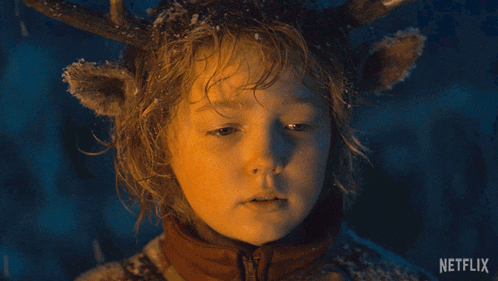 a child with antlers on his head says i 'm kidding