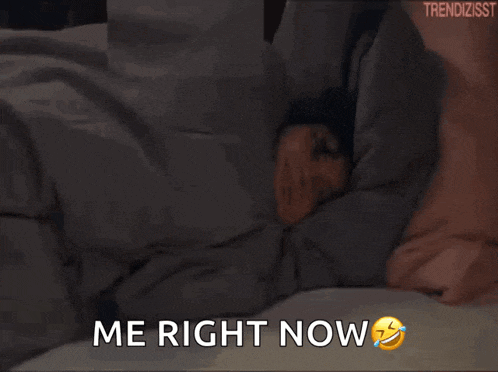 a woman is laying in bed with the words me right now