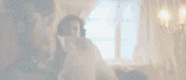 a man and woman are having sex in a bedroom .