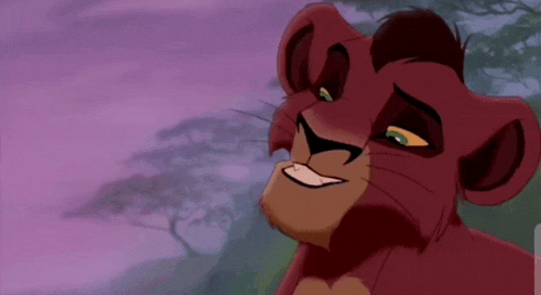 a lion from the lion king is smiling and looking at the camera with trees in the background .