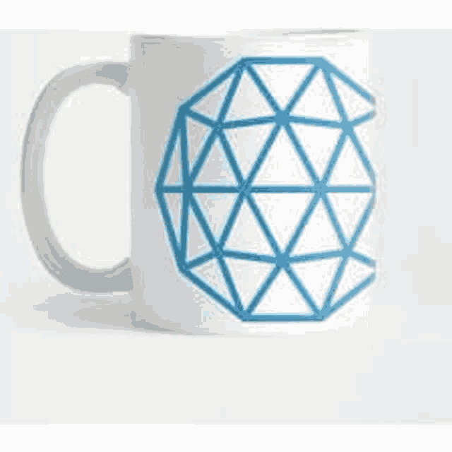 a white mug with a blue geometric pattern on it .