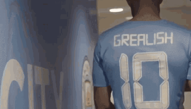 a man wearing a blue jersey with the number 10 on it