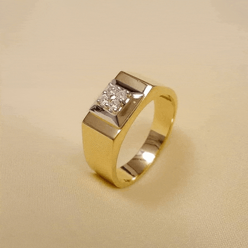 a yellow gold ring with a diamond in the middle