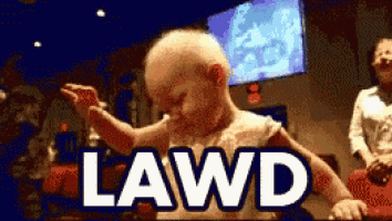 a baby is dancing in front of a sign that says lawd on it