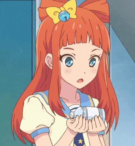 a girl with red hair and a bell on her head holds a bottle of water