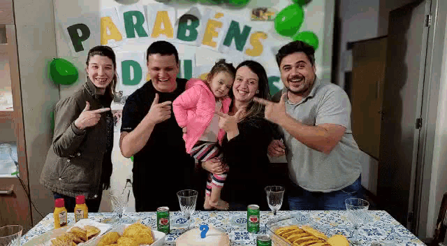 a group of people are posing for a picture in front of a banner that says parabens