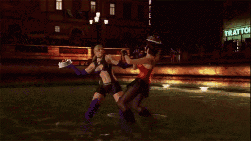 two women are fighting in front of a tratto sign