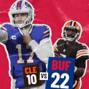 two football players holding up signs one of which says cle 10 vs 22