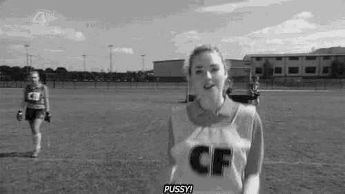 a woman in a cf jersey is standing on a field and talking .
