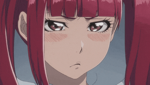 a girl with red hair is making a funny face