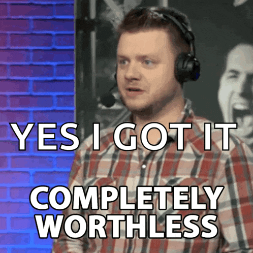 a man wearing headphones and a plaid shirt says " yes i got it completely worthless "