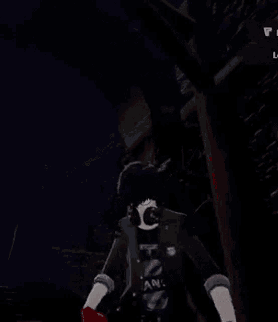 a man wearing headphones is standing in a dark room .