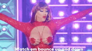 a woman in a red dress is dancing on a stage .