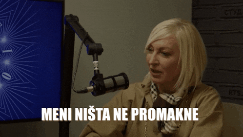 a woman sitting in front of a microphone with the words " meni nista ne promakne " written below her