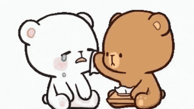 a couple of teddy bears are sitting next to each other and one is crying .