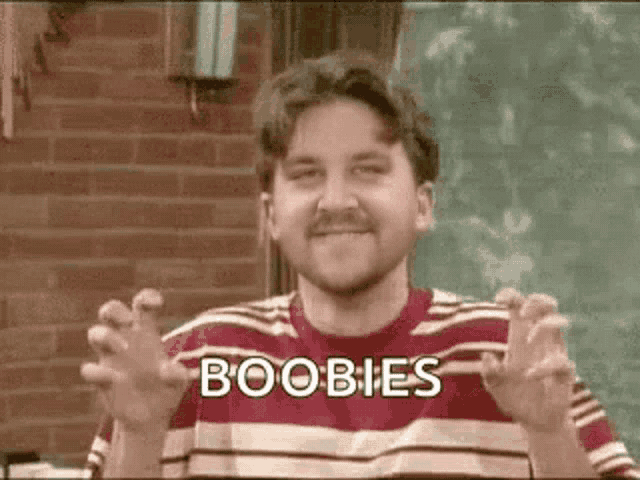a man with a mustache is wearing a striped shirt and making a funny face with his hands outstretched .