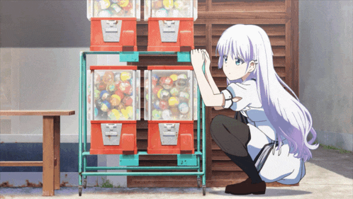 a girl squatting down in front of a machine that says ' x ' on it