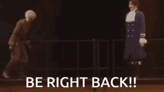 a man in a blue coat is standing next to a woman in a brown jacket and the words be right back are on the bottom