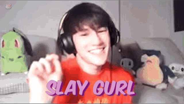 a young man wearing headphones and a red shirt is smiling and says slay curl .