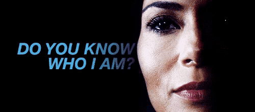 a close up of a woman 's face with the words do you know who i am below it