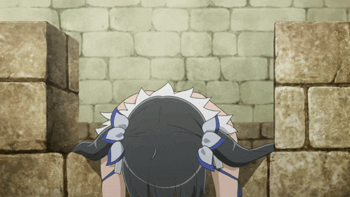 a girl with a ponytail is standing in front of a brick wall
