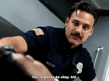 a police officer with a mustache says " you 're gonna be okay, kid "