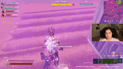 a woman playing a video game with the words espectadores on the top left