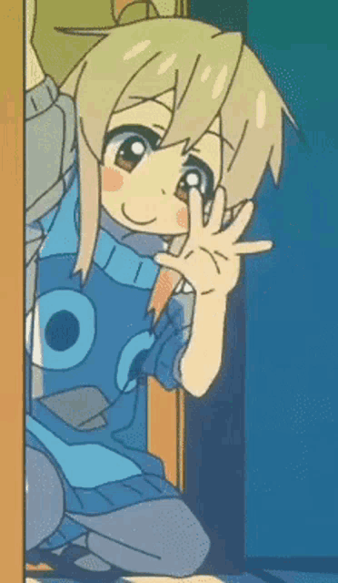 a girl in a blue sweater is waving