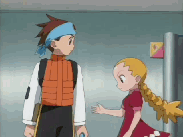 a boy and a girl are standing next to each other in a hallway