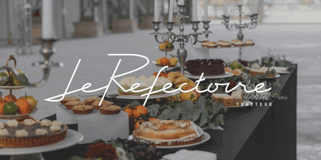 a table with a lot of desserts and candles and the words le refletourne