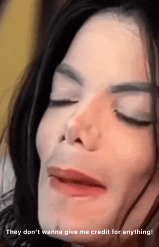 a close up of a woman 's face with the words " they don 't wanna give me credit for anything " below her