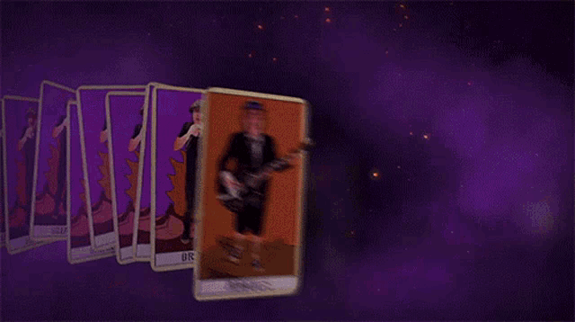a row of angus tarot cards with a man playing a guitar on them