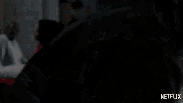 a netflix ad shows a man looking at a cell phone