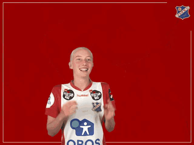 a woman wearing a red and white shirt that says obos on it