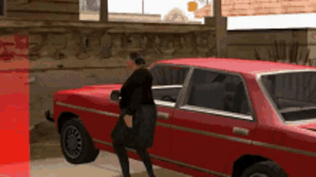 a man standing next to a red car with a bag on his shoulder