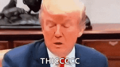 donald trump is sitting in a chair with his eyes closed and a red face .