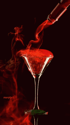 a martini glass with smoke coming out of it and the name maryla on the bottom