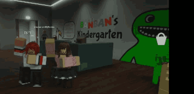 the word kindergarten is on a wall next to a green monster