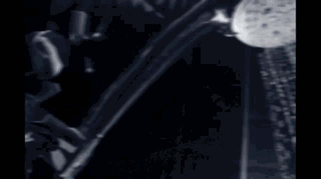 a close up of a shower head with water spraying from it