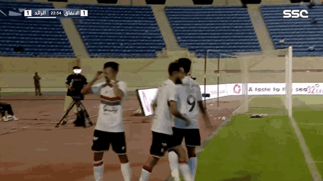 soccer players on a field with the number 9 on their back