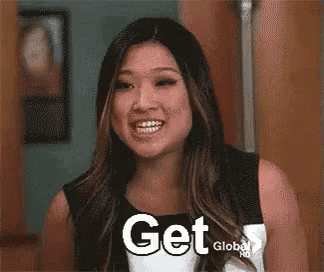 a woman is screaming with her mouth open and the words `` the fuck '' written on her face .