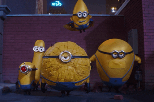 a group of minions are standing in front of a brick wall and a sign that says atlas