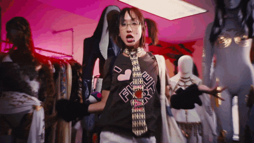 a woman wearing a shirt that says ' freaky ' on it