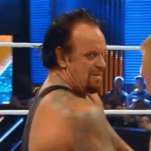 Undertaker Laughing Hysterically GIF - Undertaker Laughing Hysterically Hahaha GIFs